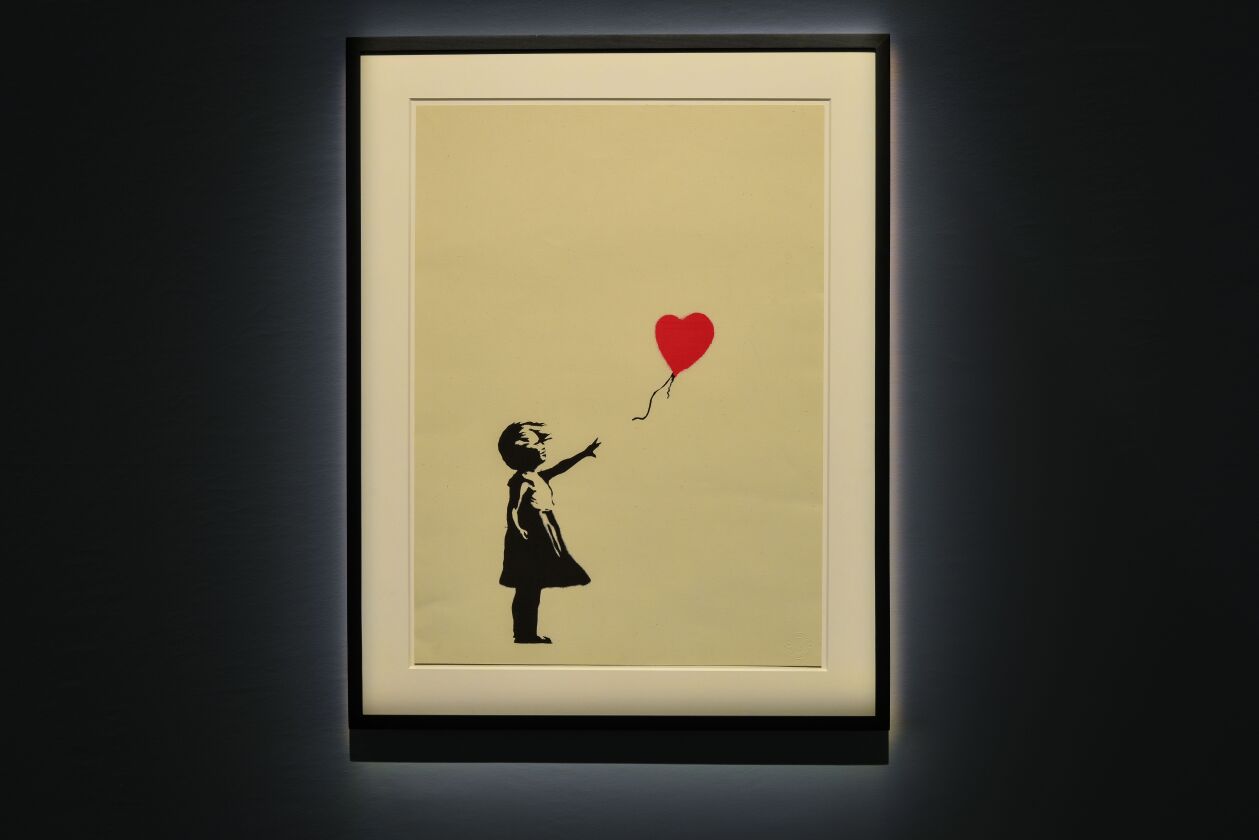 “Girl with Balloon” by Banksy will be featured in “The Art of Banksy” at the Epiphany Center for the Arts in the West Loop.